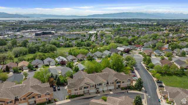 view of property location featuring a mountain backdrop and nearby suburban area