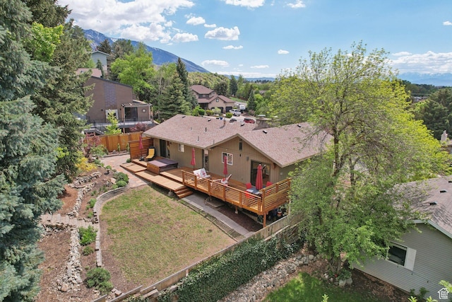 view of subject property featuring a mountain backdrop