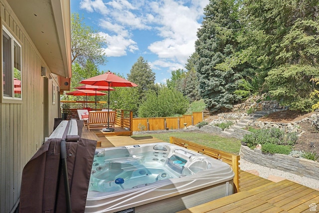 deck featuring a hot tub