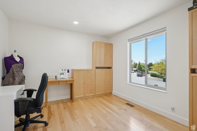 office space with light wood-style flooring, baseboards, and recessed lighting