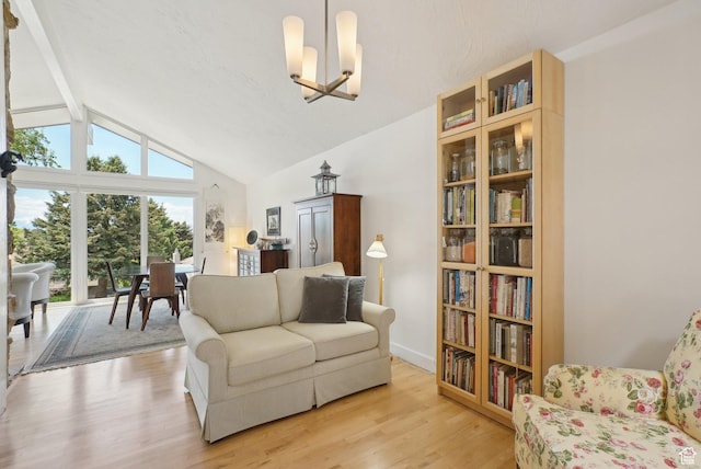 living room with a chandelier and light wood-style flooring