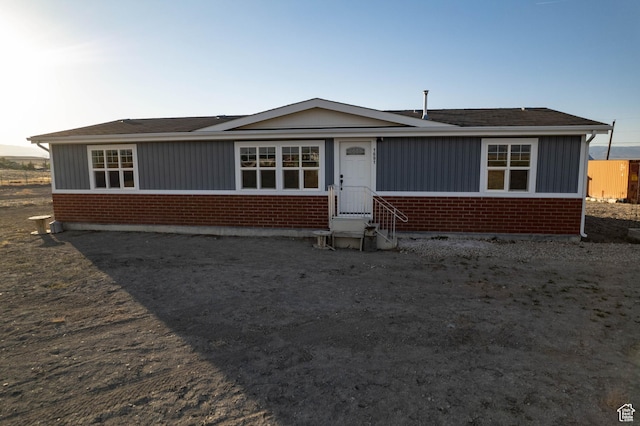 1691 E 8900 S, Price, UT 84501 - view of front facade with entry steps, brick siding, and roof with shingles