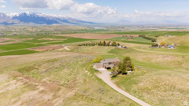aerial view of sparsely populated area featuring a mountainous background