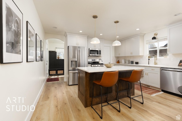 1340 S 740 E, Lehi, UT 84043 - kitchen featuring appliances with stainless steel finishes, light wood-type flooring, light countertops, white cabinets, and a kitchen island