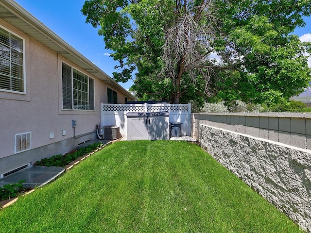 view of yard with central AC