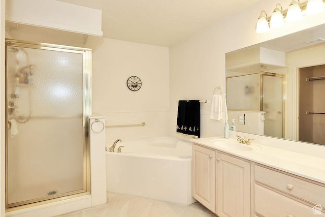 full bathroom with a stall shower, a bath, and vanity
