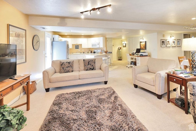 living room featuring light carpet