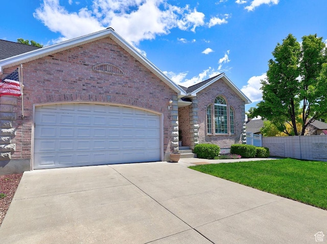 view of front of property featuring brick siding, concrete driveway, and an attached garage