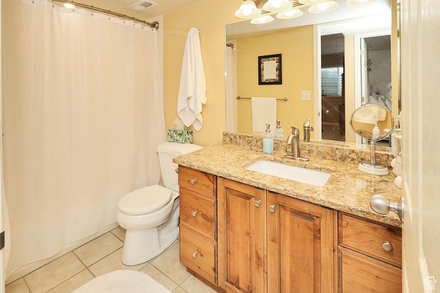 full bathroom with tile patterned floors, toilet, and vanity