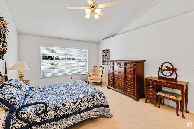 bedroom featuring lofted ceiling, light carpet, and a ceiling fan