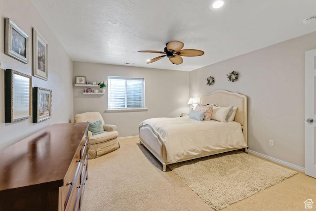 bedroom featuring carpet floors, baseboards, and ceiling fan