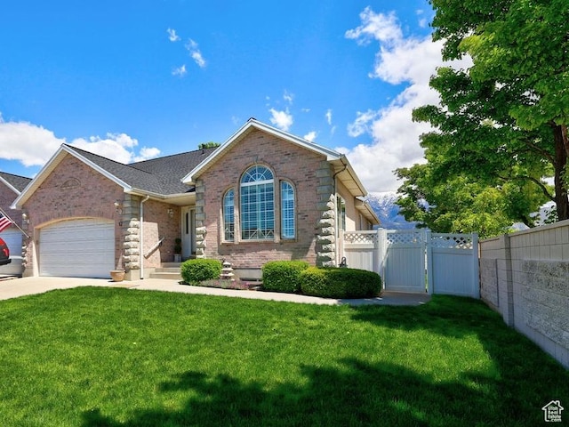 view of front of property with a garage, brick siding, concrete driveway, and a gate