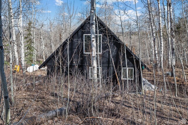 view of outbuilding with a wooded view