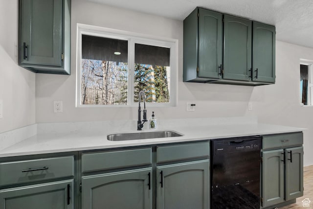 bar area with black dishwasher, a sink, and wood finished floors