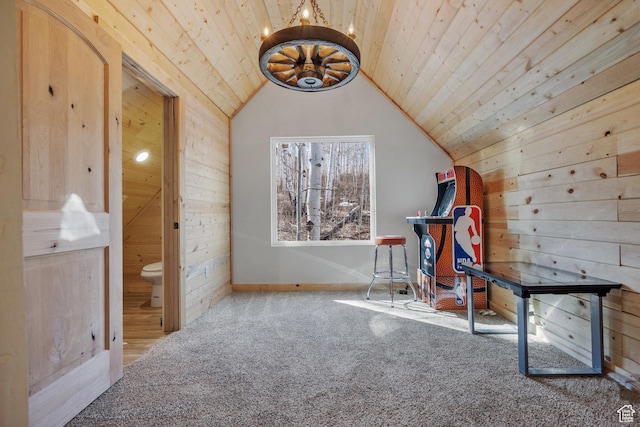 additional living space featuring wooden walls, wooden ceiling, carpet flooring, lofted ceiling, and baseboards