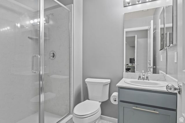 full bathroom with a stall shower, toilet, and vanity