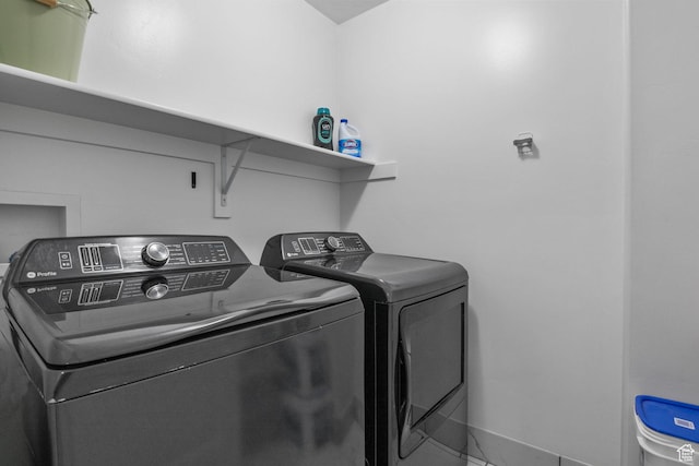 washroom with washer and dryer