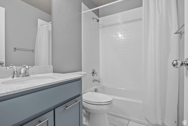 bathroom featuring vanity, shower / tub combo with curtain, toilet, and tile patterned flooring