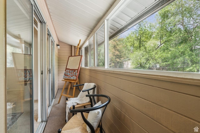 sunroom / solarium with plenty of natural light and lofted ceiling