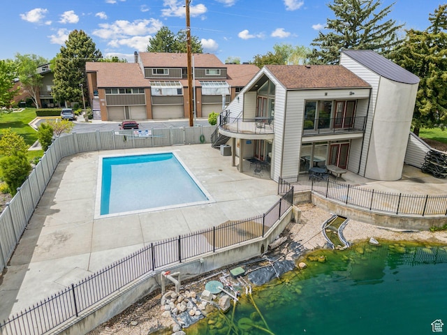 view of pool featuring a patio and a fenced backyard