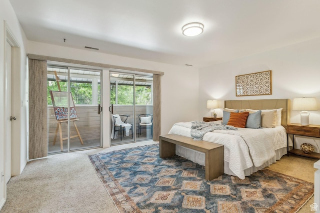 carpeted bedroom featuring access to exterior