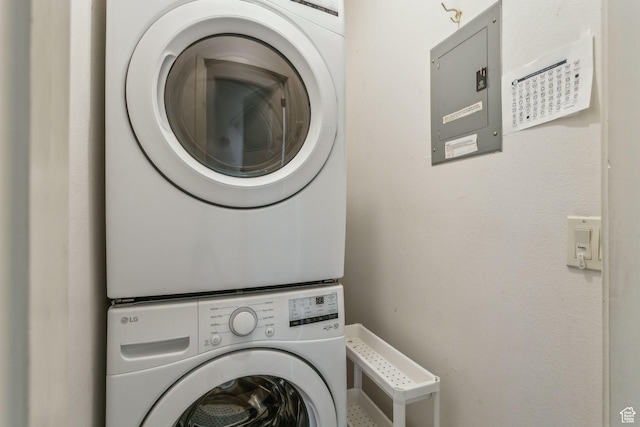 laundry room featuring stacked washing machine and dryer