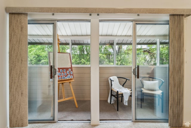 doorway to outside featuring speckle patterned floor