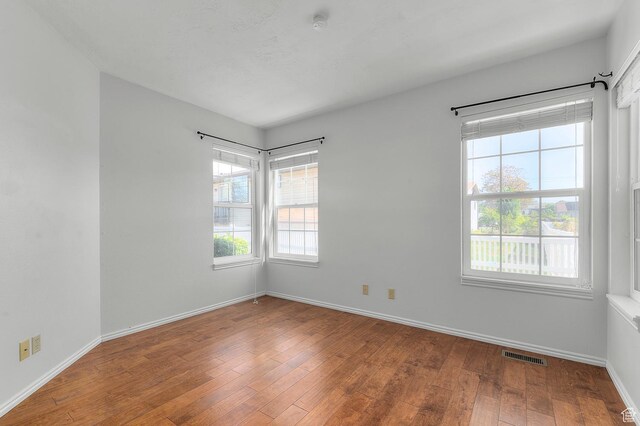 819 N 225 W, Bountiful, UT 84010 - spare room featuring wood-type flooring and baseboards