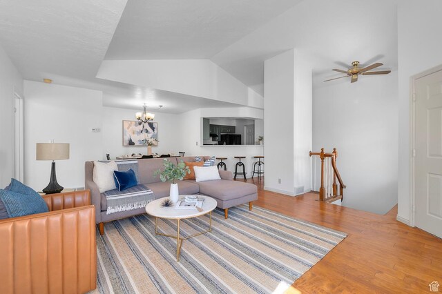 819 N 225 W, Bountiful, UT 84010 - living area with wood finished floors, a chandelier, ceiling fan, and lofted ceiling