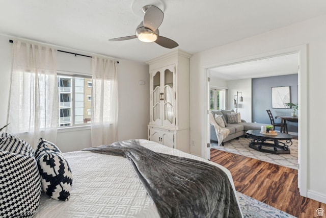 bedroom with wood finished floors and ceiling fan