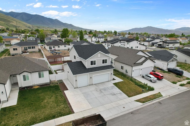 aerial view of residential area featuring a mountainous background