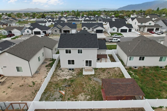 aerial perspective of suburban area featuring a mountain backdrop