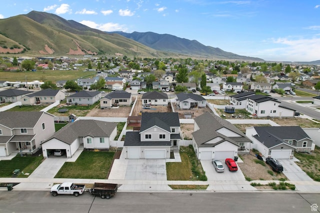 aerial view of residential area featuring mountains