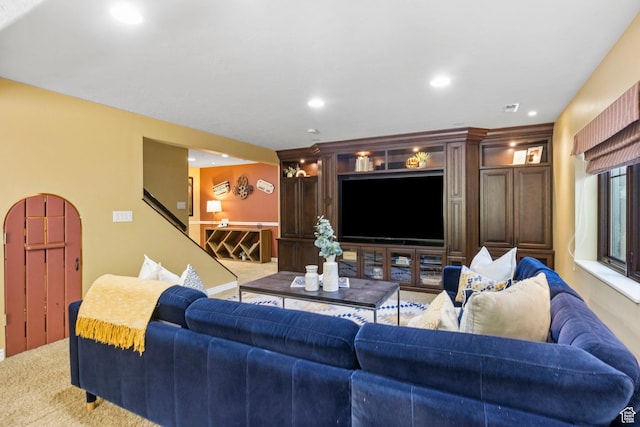 living area with carpet flooring, recessed lighting, and stairway