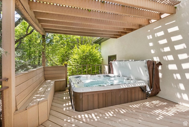 wooden deck featuring a hot tub