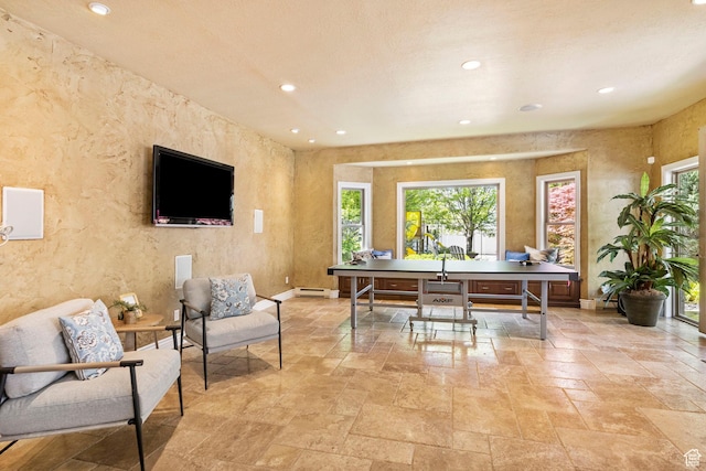 office with stone tile flooring, recessed lighting, baseboard heating, and baseboards
