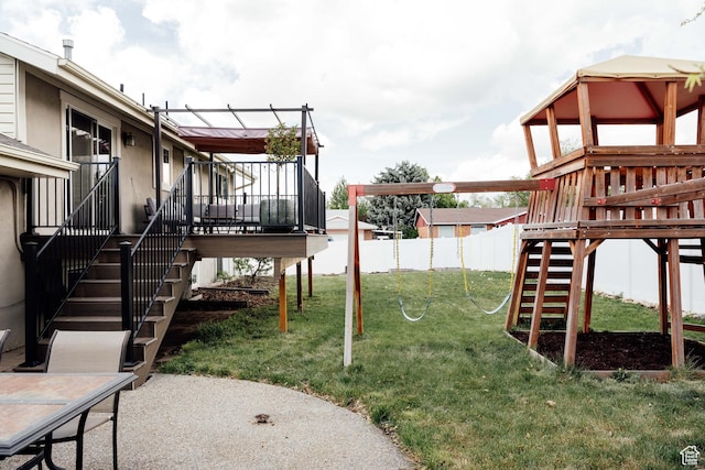 view of yard with stairway, a wooden deck, and a patio area