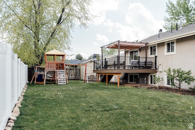 view of yard with a playground, a wooden deck, and cooling unit