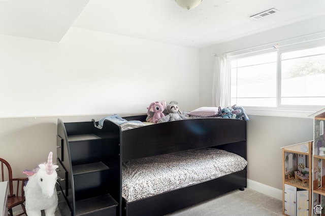 carpeted bedroom featuring baseboards