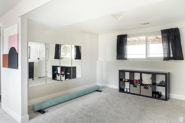 recreation room with carpet flooring and baseboards