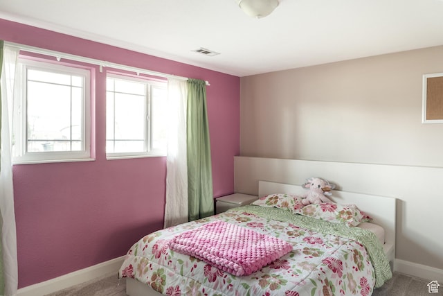 bedroom featuring carpet flooring and baseboards