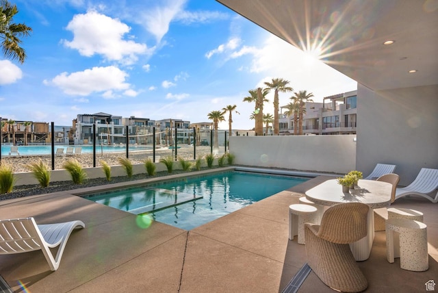 833 W Savoy Ln, St George, UT 84790 - view of swimming pool featuring fence, a pool with connected hot tub, and a patio