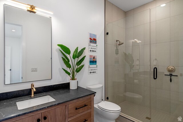 833 W Savoy Ln, St George, UT 84790 - bathroom featuring toilet, a shower stall, and vanity