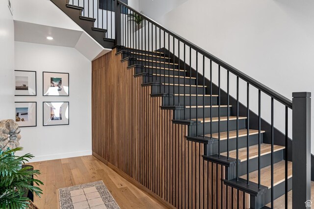 833 W Savoy Ln, St George, UT 84790 - staircase featuring hardwood / wood-style flooring, recessed lighting, baseboards, and wood walls