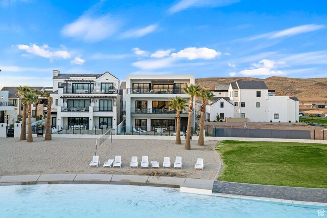 833 W Savoy Ln, St George, UT 84790 - back of property featuring a balcony and a lawn