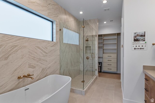 833 W Savoy Ln, St George, UT 84790 - bathroom with vanity, a freestanding tub, a shower stall, tile patterned floors, and recessed lighting