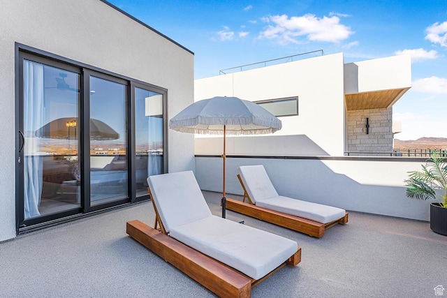 view of patio with a balcony