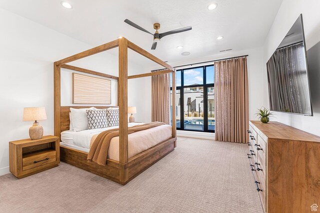bedroom with light colored carpet, recessed lighting, access to outside, floor to ceiling windows, and a ceiling fan