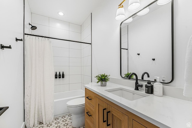 bathroom featuring vanity, toilet, and shower / bath combo