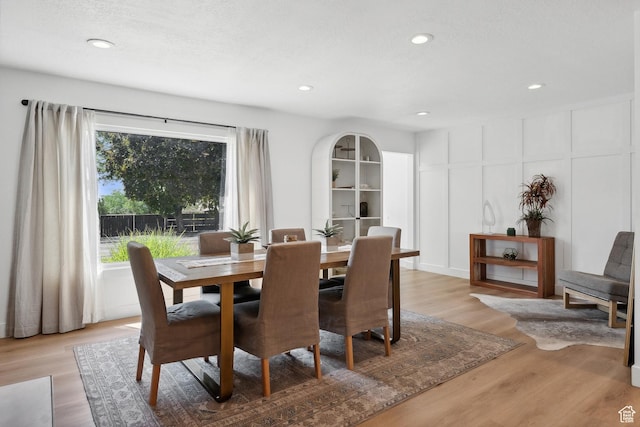 dining room with light wood-style floors and recessed lighting